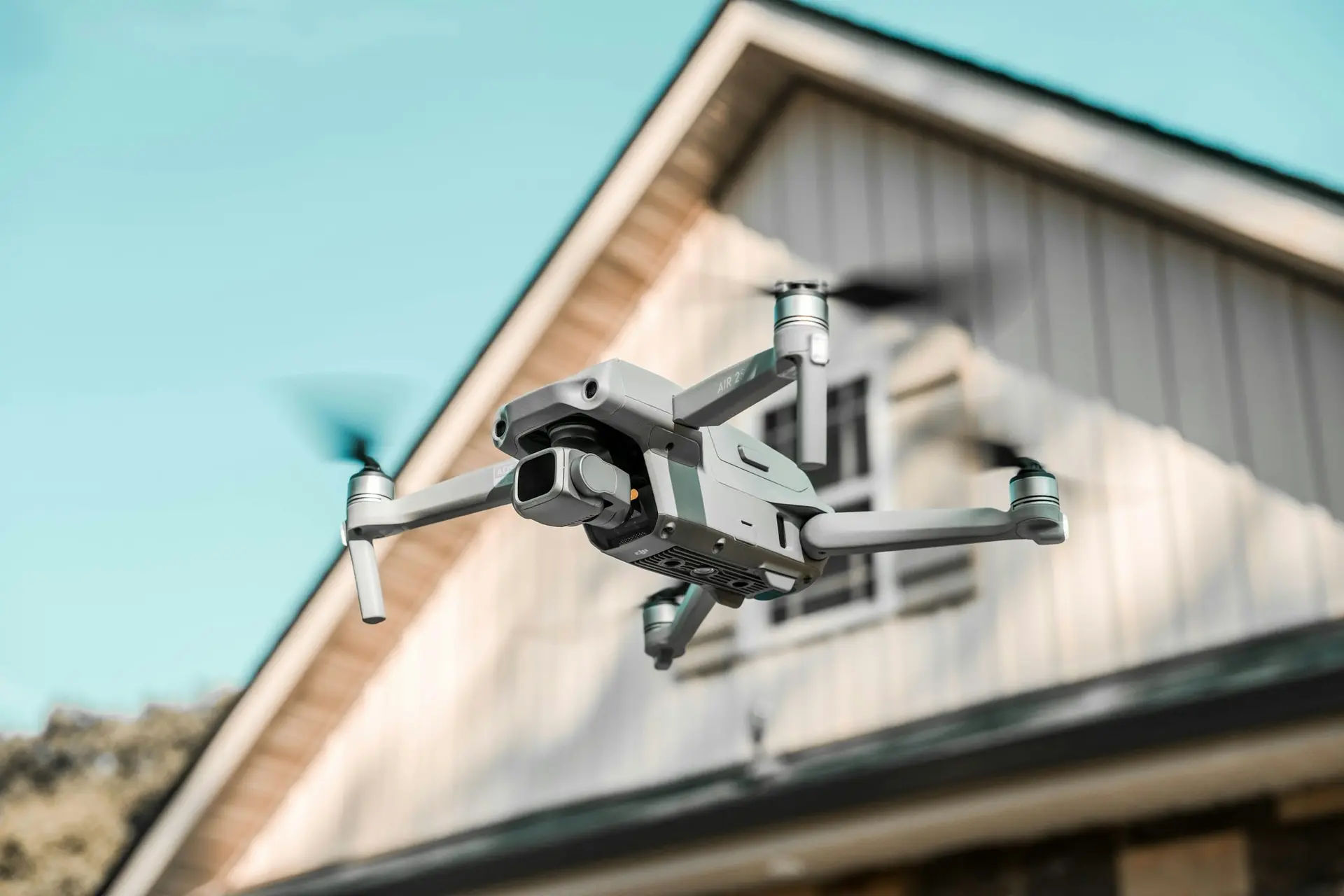 Drone inspecting the roofline of a home