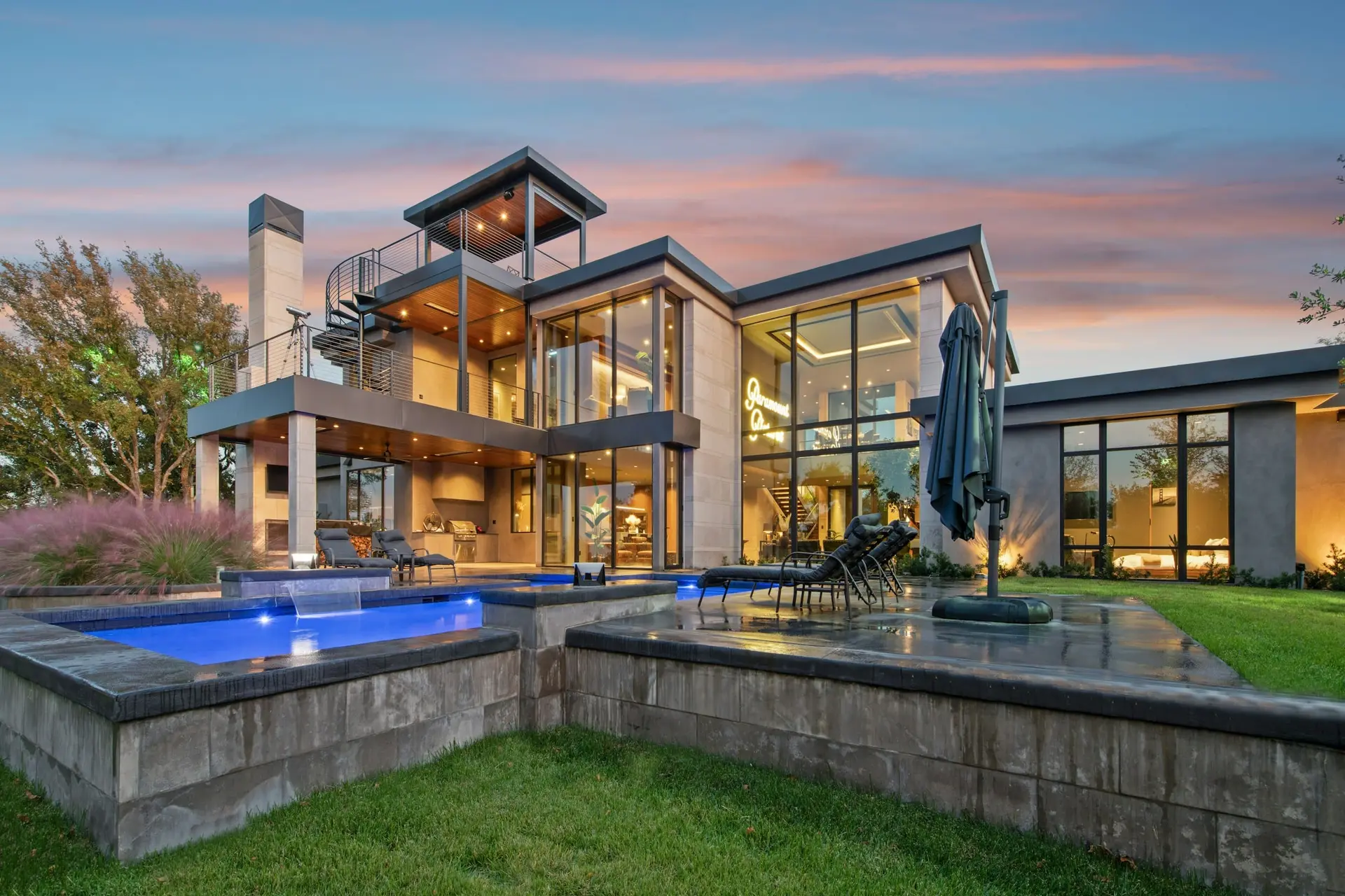Contemporary estate home with clean low-slope rooflines and outdoor living area